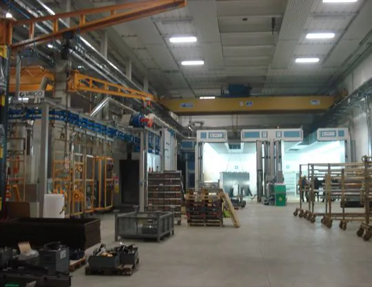 Liquid painting system complete with two pressurized oven booths for large products, and upper opening for inserting pieces with overhead crane