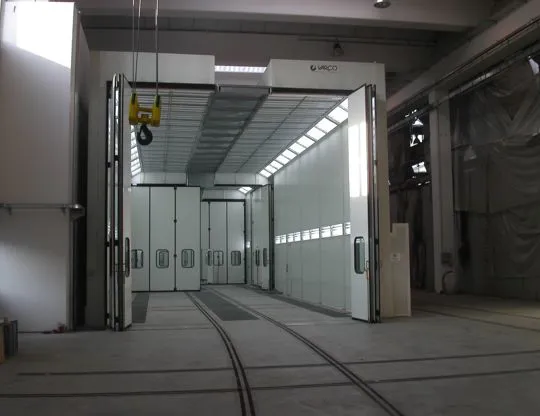 Pressurized oven booth with four independent stages with tracks for sliding piece holder trolleys and total upper opening for inserting pieces even with overhead crane