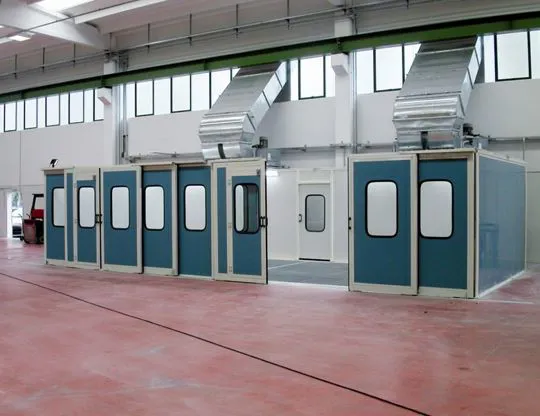 Grid floor with wet filtering system  and perimeter panels with sliding doors and upper lighting