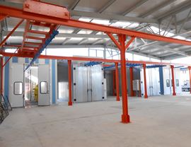 Powder coating plant with overhead conveyor complete with motorized transfer for manual handling of 8,000 mm long hangers