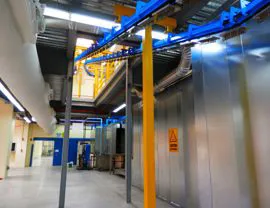 View of the ascent of the overhead conveyor to the upper floor