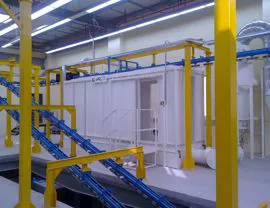 Powder coating booth with dust recovery made with PVC paneling  and descent of the overhead conveyor to the lower floor